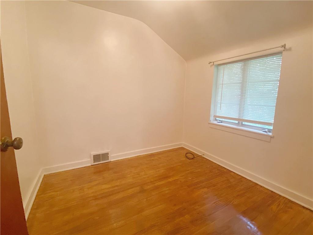 515 Filmore Road Pittsburgh, PA 15221 - Photo 11 of 14 an empty room with a window