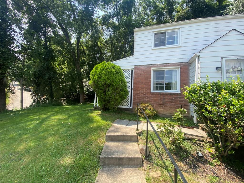 515 Filmore Road Pittsburgh, PA 15221 - Photo 14 of 14 a front view of a house with a yard
