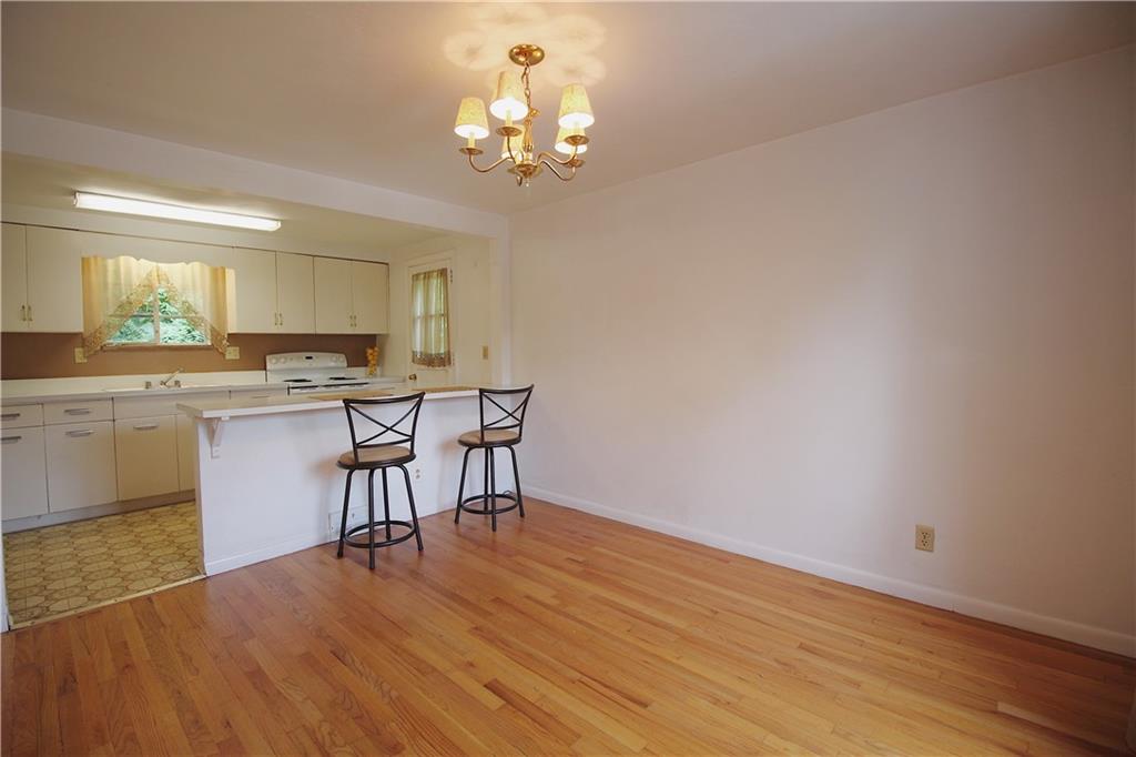 515 Filmore Road Pittsburgh, PA 15221 - Photo 5 of 14 a view of a dining room with furniture and wooden floor