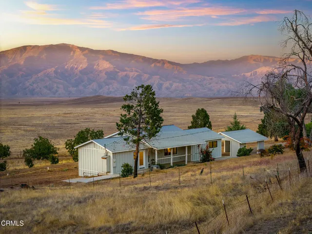 a view of a house with a ocean view