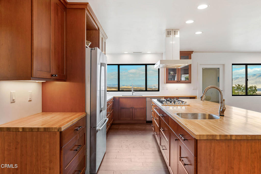 2170 Aliso Park Road Maricopa, CA 93252 - Photo 29 of 72 a kitchen with a sink stove and cabinets