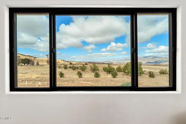 a view of a house with a snow in the yard