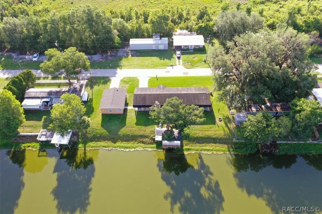 928 South Shad Terrace Inverness, FL 34450 - Photo 41 of 48 a aerial view of a house with swimming pool and lake view