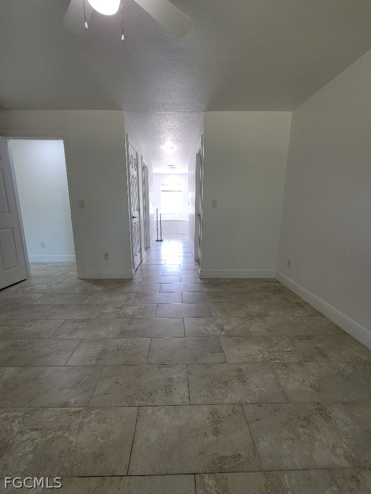 355 Paddock Street Lehigh Acres, FL 33974 - Photo 16 of 29 a view of a hallway