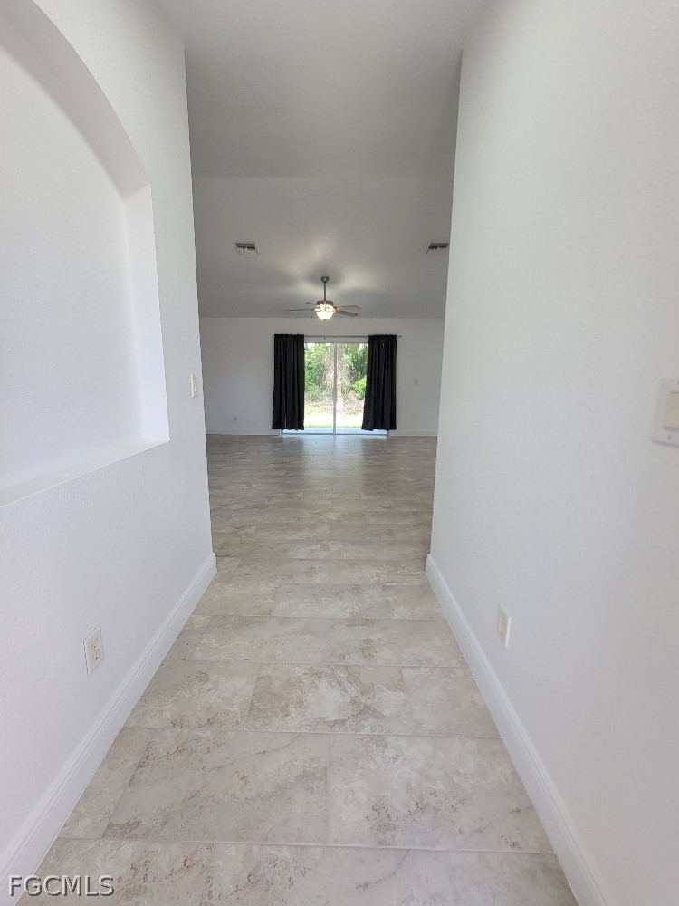 355 Paddock Street Lehigh Acres, FL 33974 - Photo 2 of 29 an empty room with windows