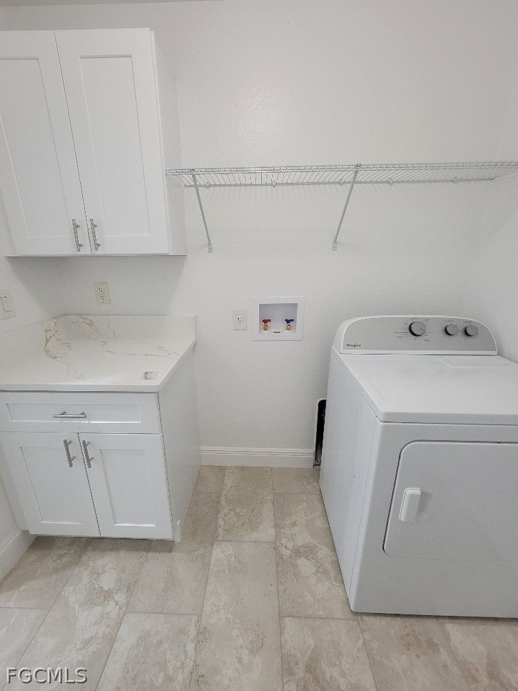 355 Paddock Street Lehigh Acres, FL 33974 - Photo 21 of 29 a utility room with dryer and washer