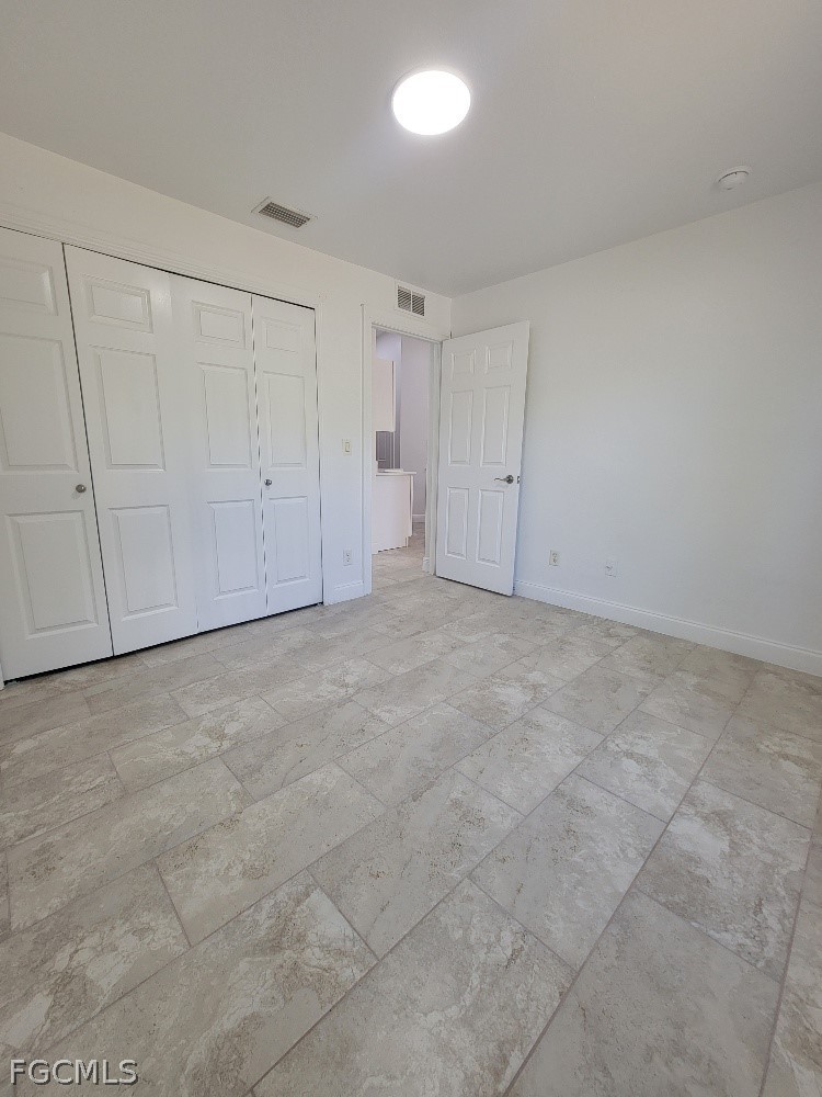 355 Paddock Street Lehigh Acres, FL 33974 - Photo 23 of 29 a view of an empty room