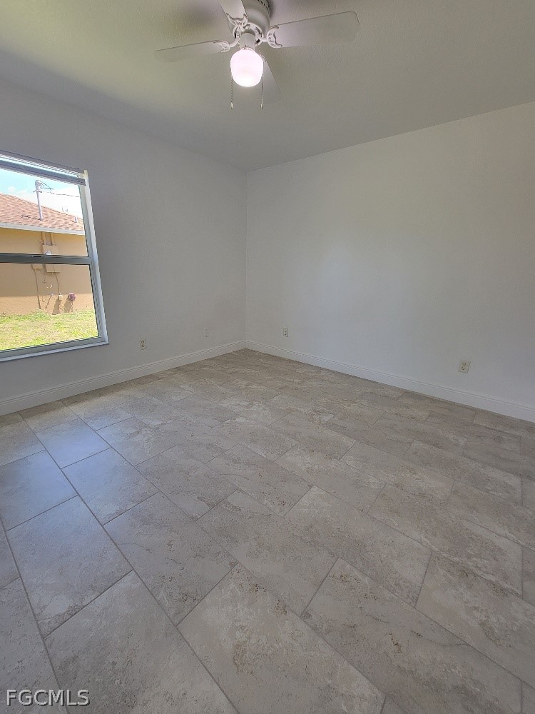 355 Paddock Street Lehigh Acres, FL 33974 - Photo 26 of 29 an empty room with a window