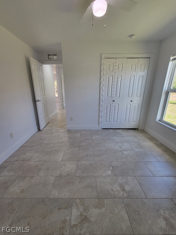 355 Paddock Street Lehigh Acres, FL 33974 - Photo 27 of 29 a view of an empty room with a window