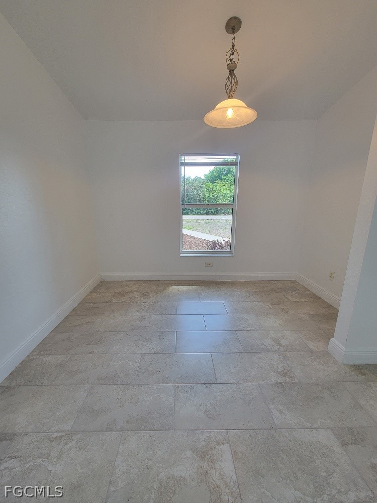 355 Paddock Street Lehigh Acres, FL 33974 - Photo 5 of 29 an empty room with a window