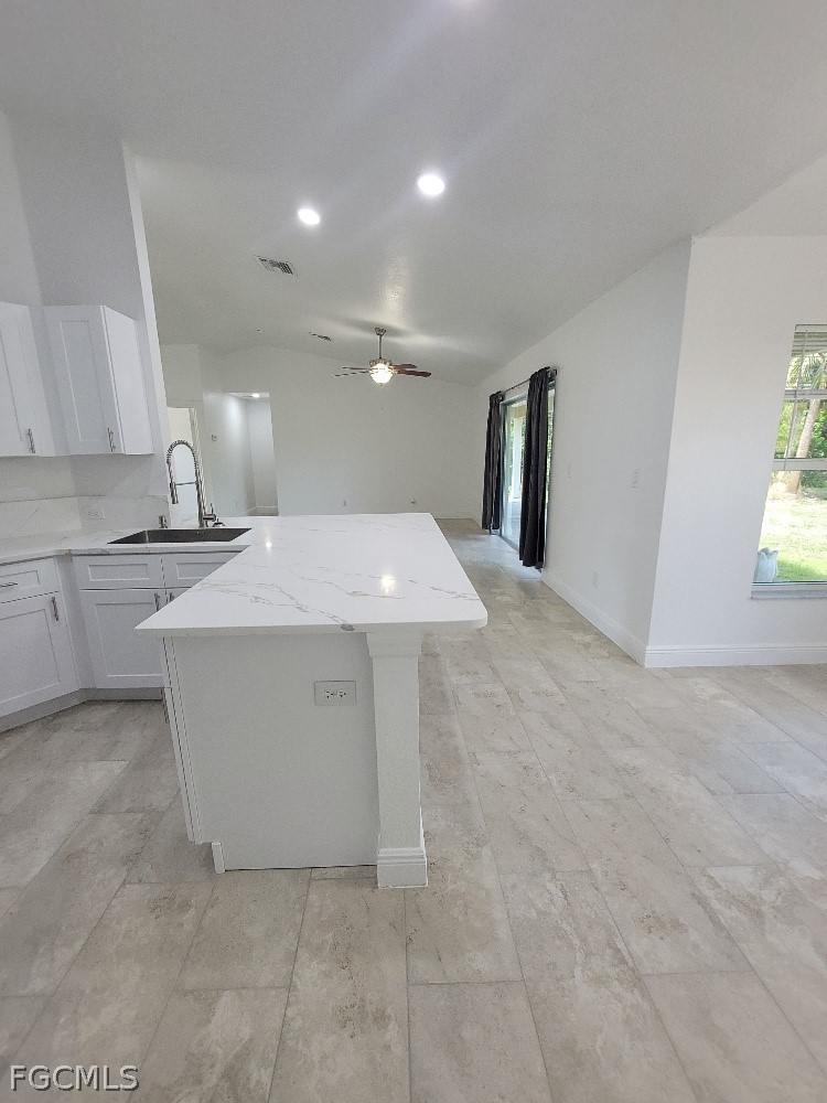 355 Paddock Street Lehigh Acres, FL 33974 - Photo 7 of 29 a view of a kitchen with a sink and dishwasher