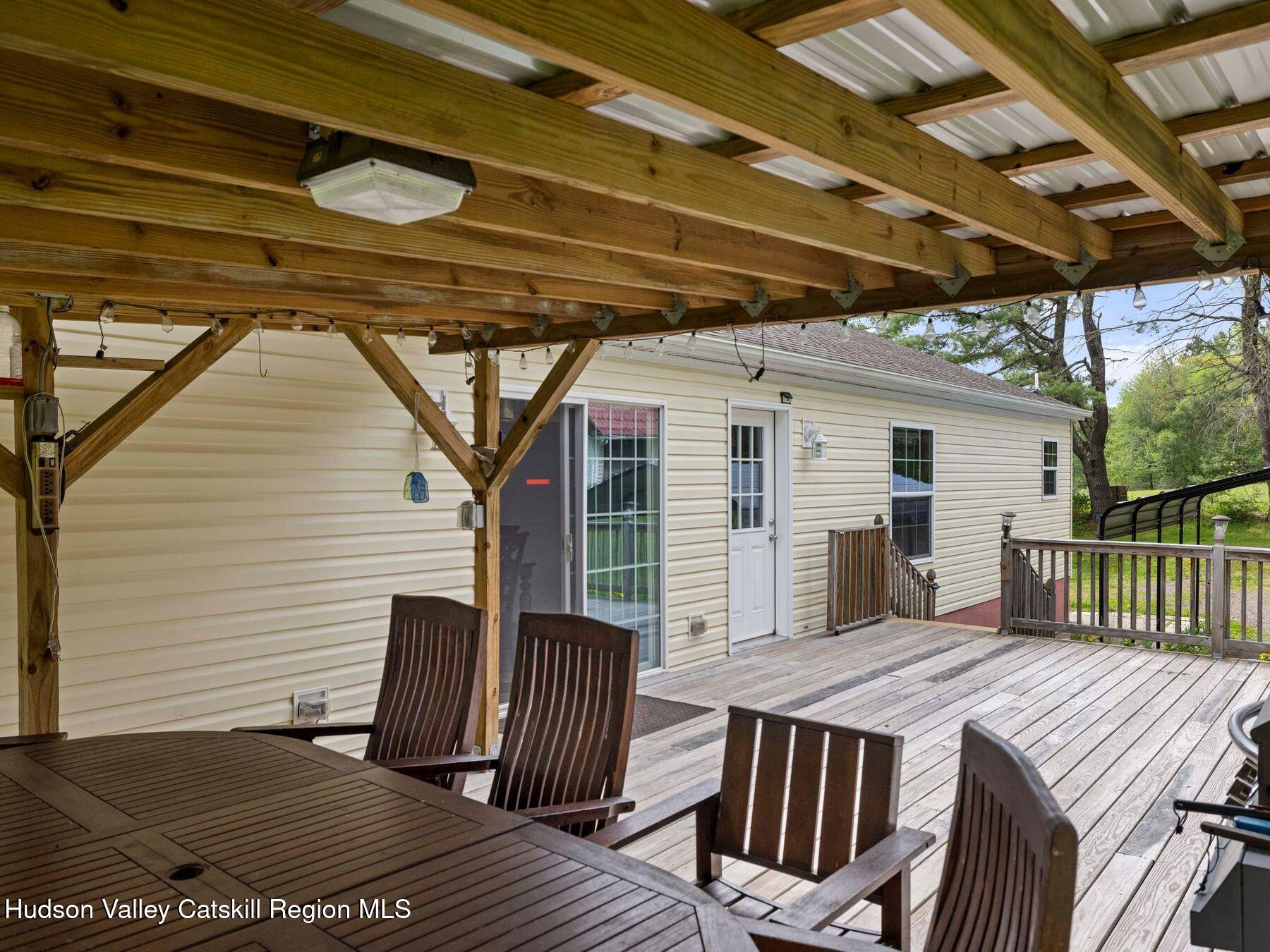 137 Mountain Pond View Road Gilboa, NY 12076 - Photo 6 of 38 a view of a patio on wooden deck