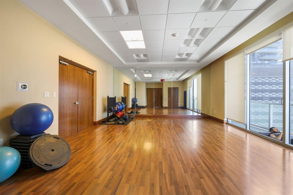 1050 Brickell Avenue, Unit 2302 Miami, FL 33131 - Photo 39 of 50 a view of a room with wooden floor and furniture