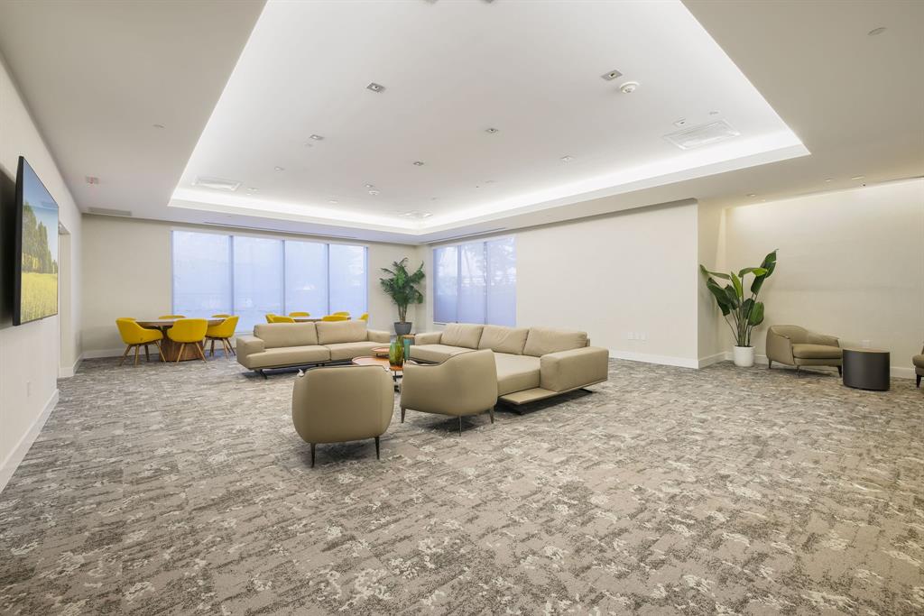 1050 Brickell Avenue, Unit 2302 Miami, FL 33131 - Photo 43 of 50 a living room with furniture and a flat screen tv