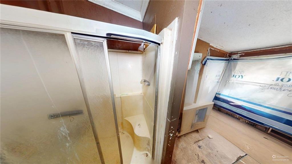 401 Towaliga Trail Forsyth, GA 31029 - Photo 10 of 29 a bathroom with a tub and a shower