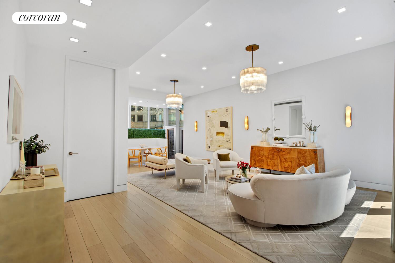 471 Washington Street, Unit THC Manhattan, NY 10013 - Photo 1 of 15 a living room with furniture and a chandelier