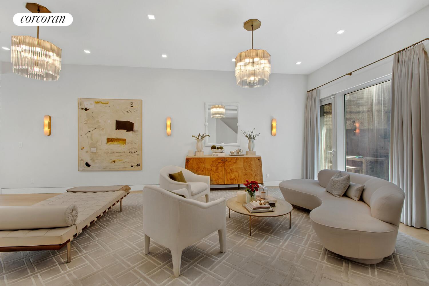 471 Washington Street, Unit THC Manhattan, NY 10013 - Photo 2 of 15 a living room with furniture and a chandelier
