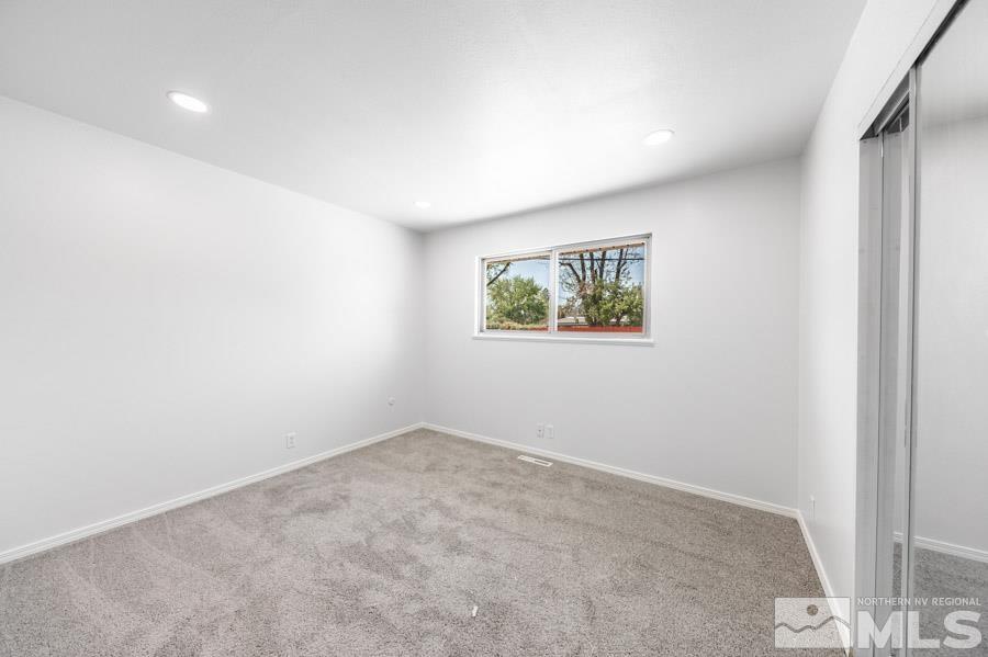 2441 Baxter Way Sparks, NV 89431 - Photo 13 of 25 an empty room with windows