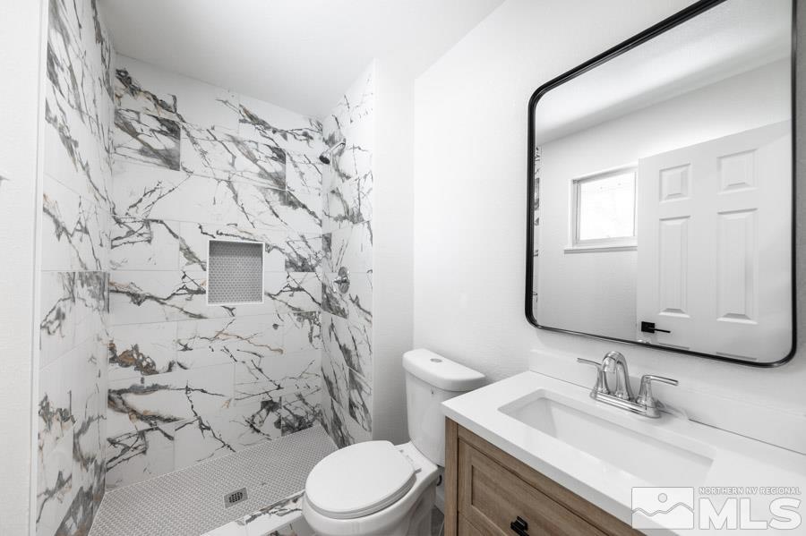 2441 Baxter Way Sparks, NV 89431 - Photo 16 of 25 a bathroom with a sink toilet and shower
