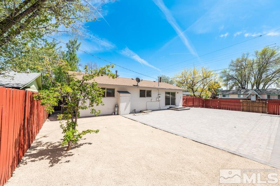2441 Baxter Way Sparks, NV 89431 - Photo 19 of 25 a front view of a house with a yard and garage