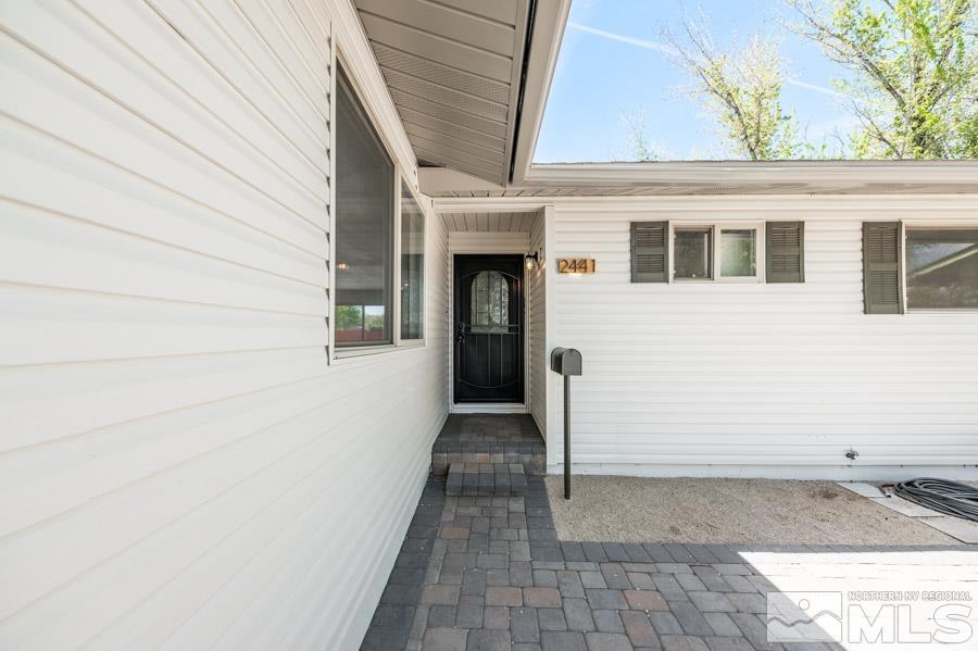 2441 Baxter Way Sparks, NV 89431 - Photo 3 of 25 a view of a house with brick walls