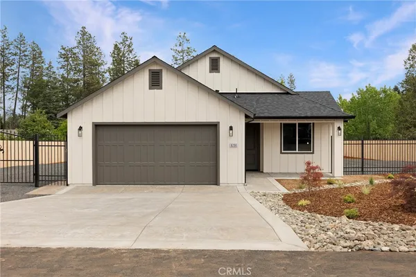 a front view of a house with a garage