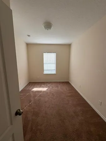 an empty room with a empty space and window