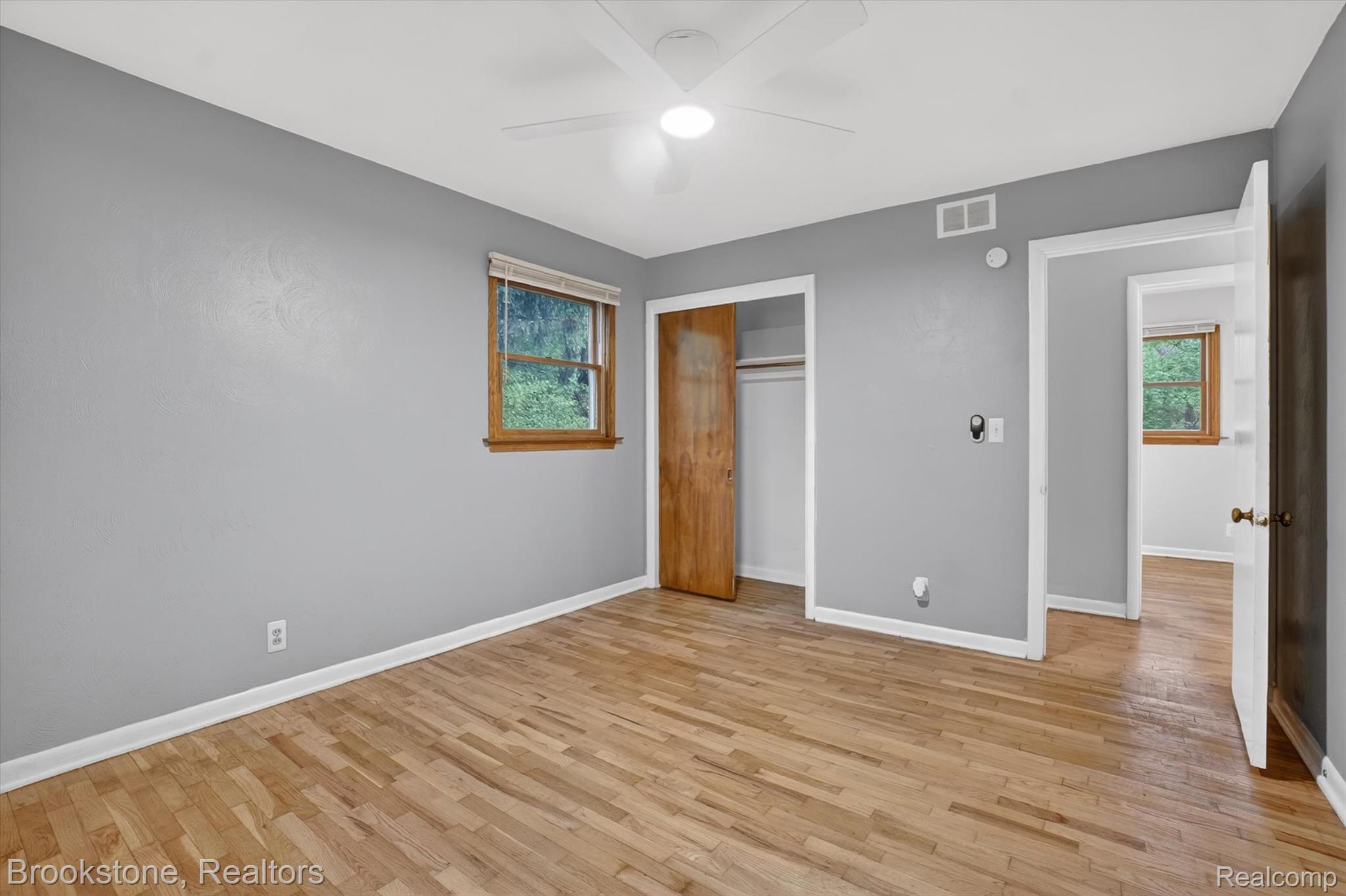 4547 Marlborough Road Okemos, MI 48864 - Photo 21 of 55 Unfurnished bedroom with light wood-style flooring, a closet, and a ceiling fan