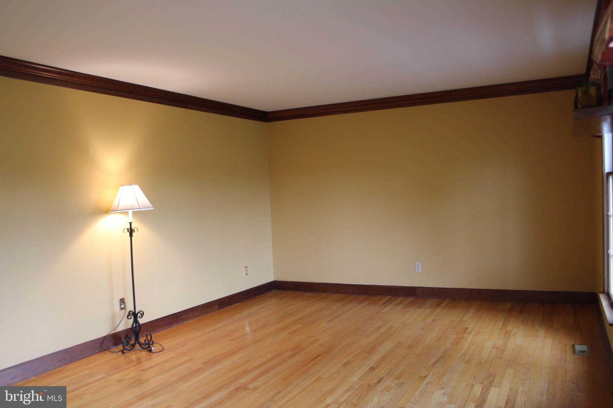 294 Starr Road Landenberg, PA 19350 - Photo 11 of 68 a view of an empty room with wooden floor and a window