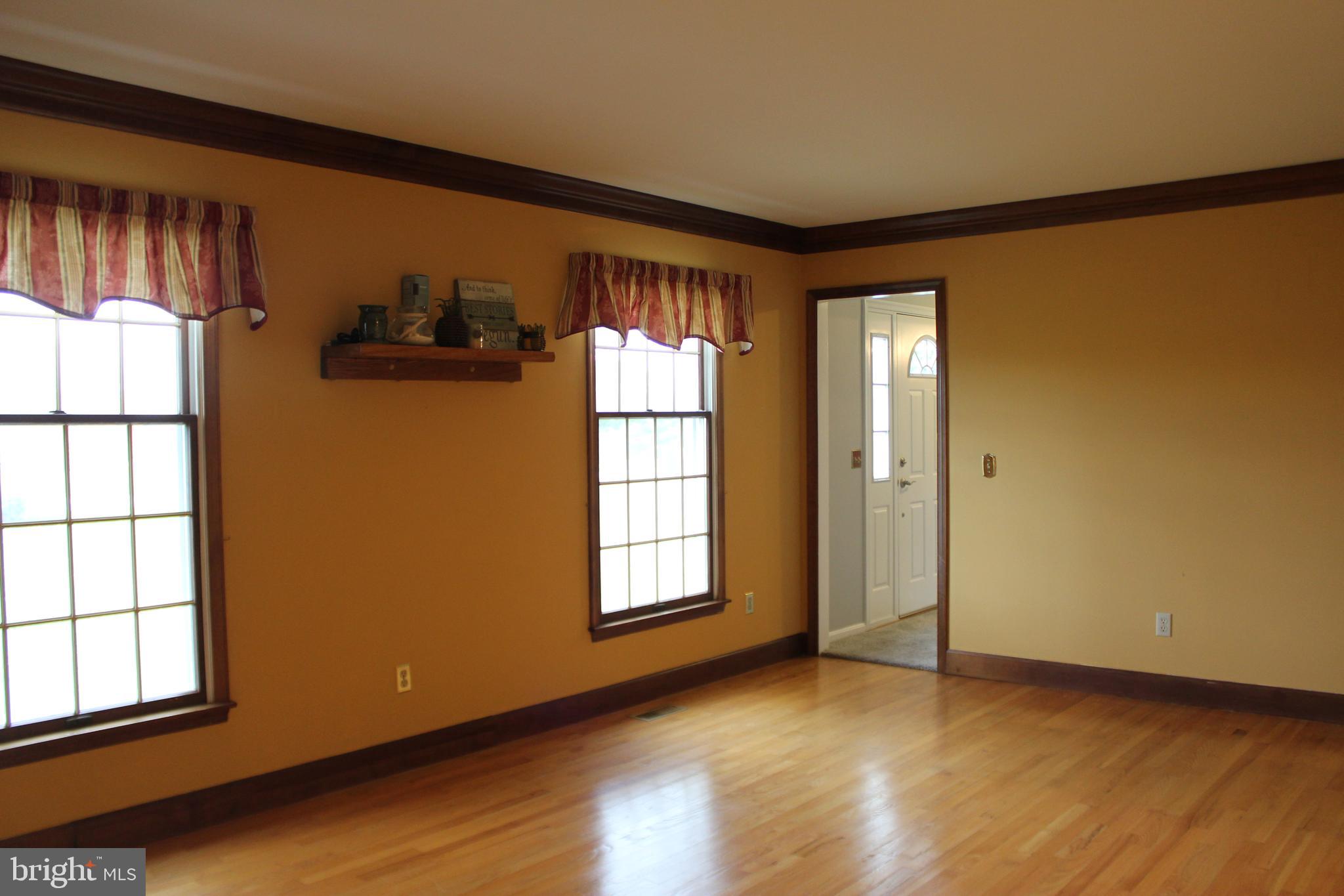 294 Starr Road Landenberg, PA 19350 - Photo 12 of 68 a view of an empty room with a window and wooden floor