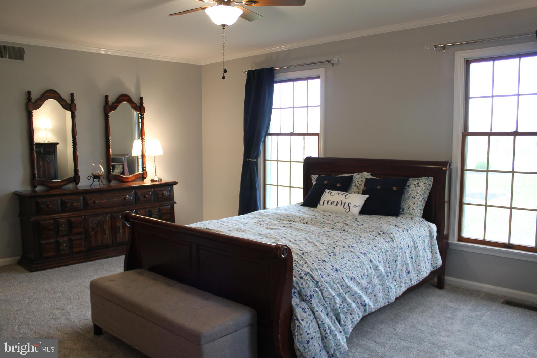 294 Starr Road Landenberg, PA 19350 - Photo 24 of 68 a bedroom with a bed and a dresser