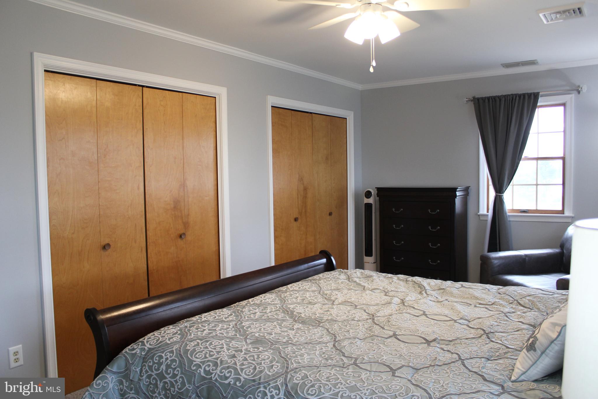 294 Starr Road Landenberg, PA 19350 - Photo 31 of 68 a bedroom with a bed and a chandelier