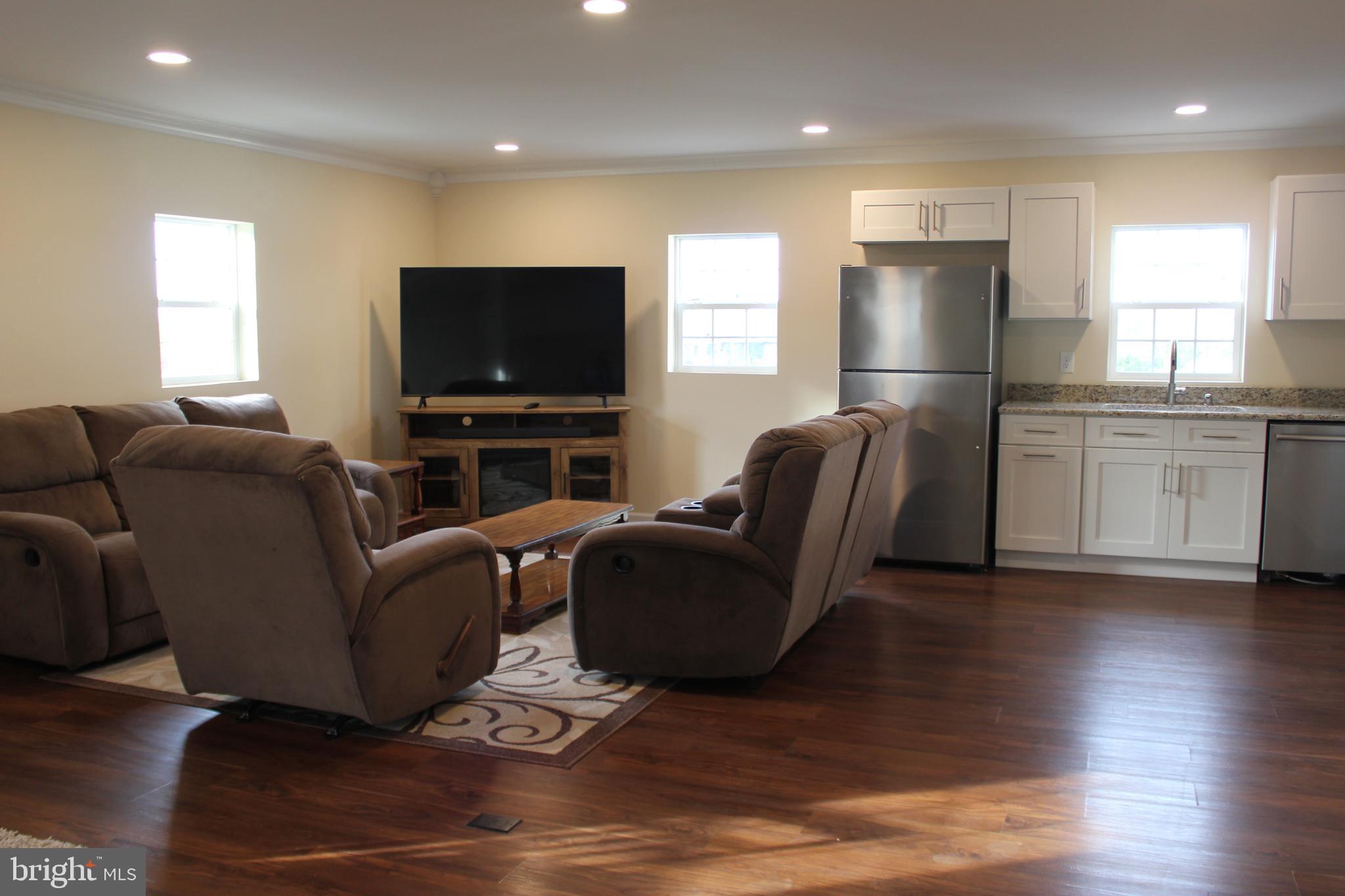 294 Starr Road Landenberg, PA 19350 - Photo 50 of 68 a living room with furniture and a flat screen tv