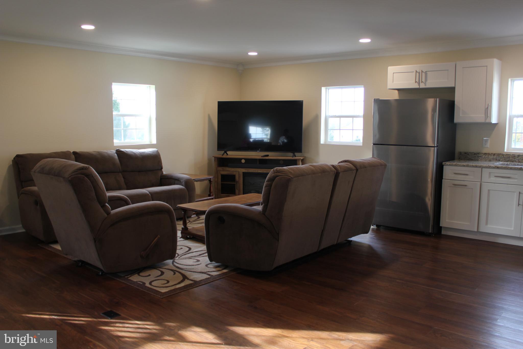 294 Starr Road Landenberg, PA 19350 - Photo 51 of 68 a living room with furniture and a flat screen tv