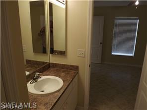 669 Homestead Road South, Unit 71 Lehigh Acres, FL 33974 - Photo 18 of 21 a bathroom with a sink and a mirror