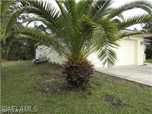 669 Homestead Road South, Unit 71 Lehigh Acres, FL 33974 - Photo 20 of 21 a view of a yard