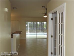 669 Homestead Road South, Unit 71 Lehigh Acres, FL 33974 - Photo 6 of 21 a view of empty room with wooden floor and fan