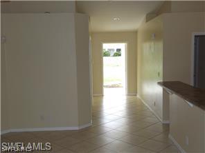 669 Homestead Road South, Unit 71 Lehigh Acres, FL 33974 - Photo 9 of 21 a view of an empty room and window