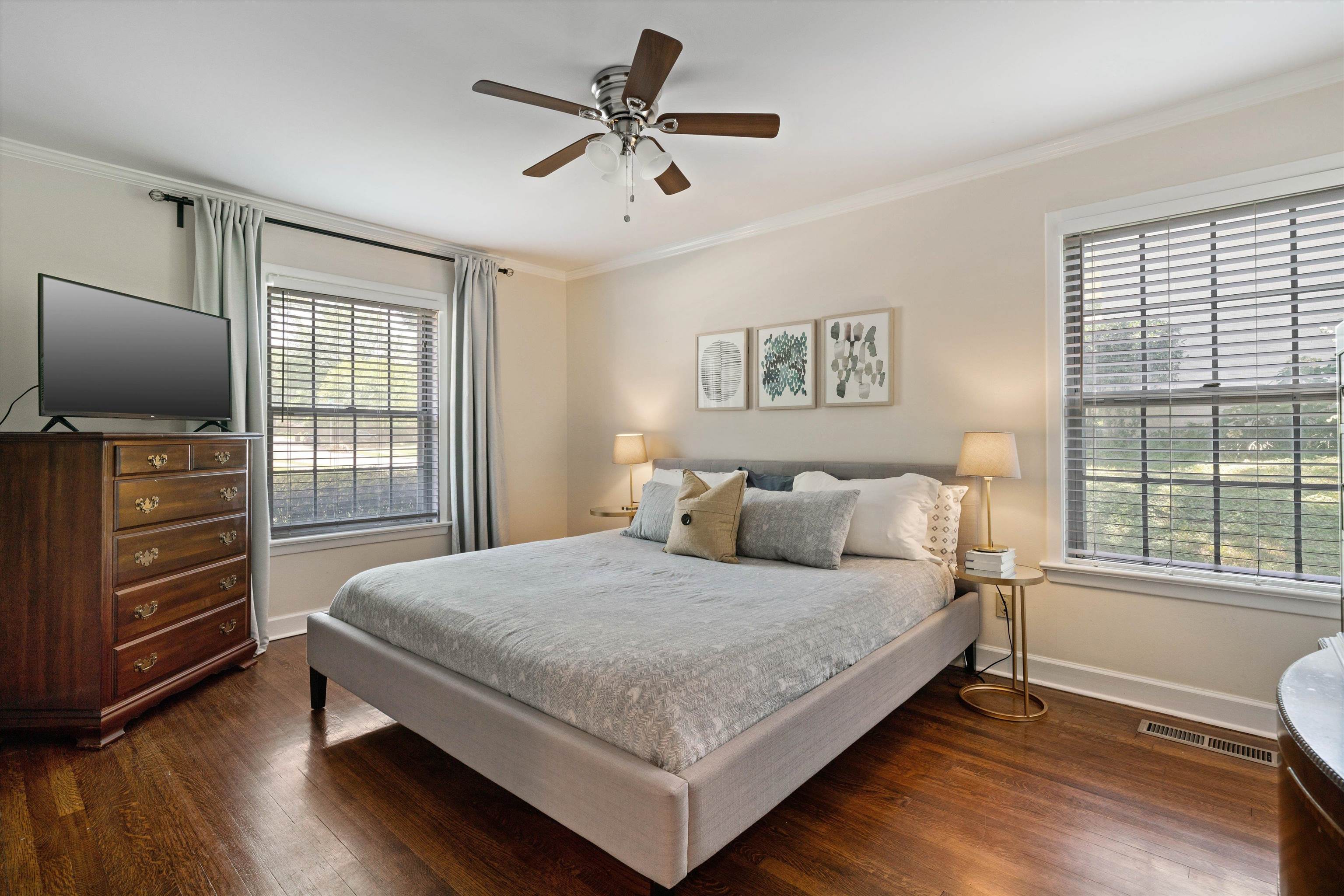 4208 Chickasaw Road Memphis, TN 38117 - Photo 13 of 25 a bedroom with a bed and a flat tv screen on a dresser