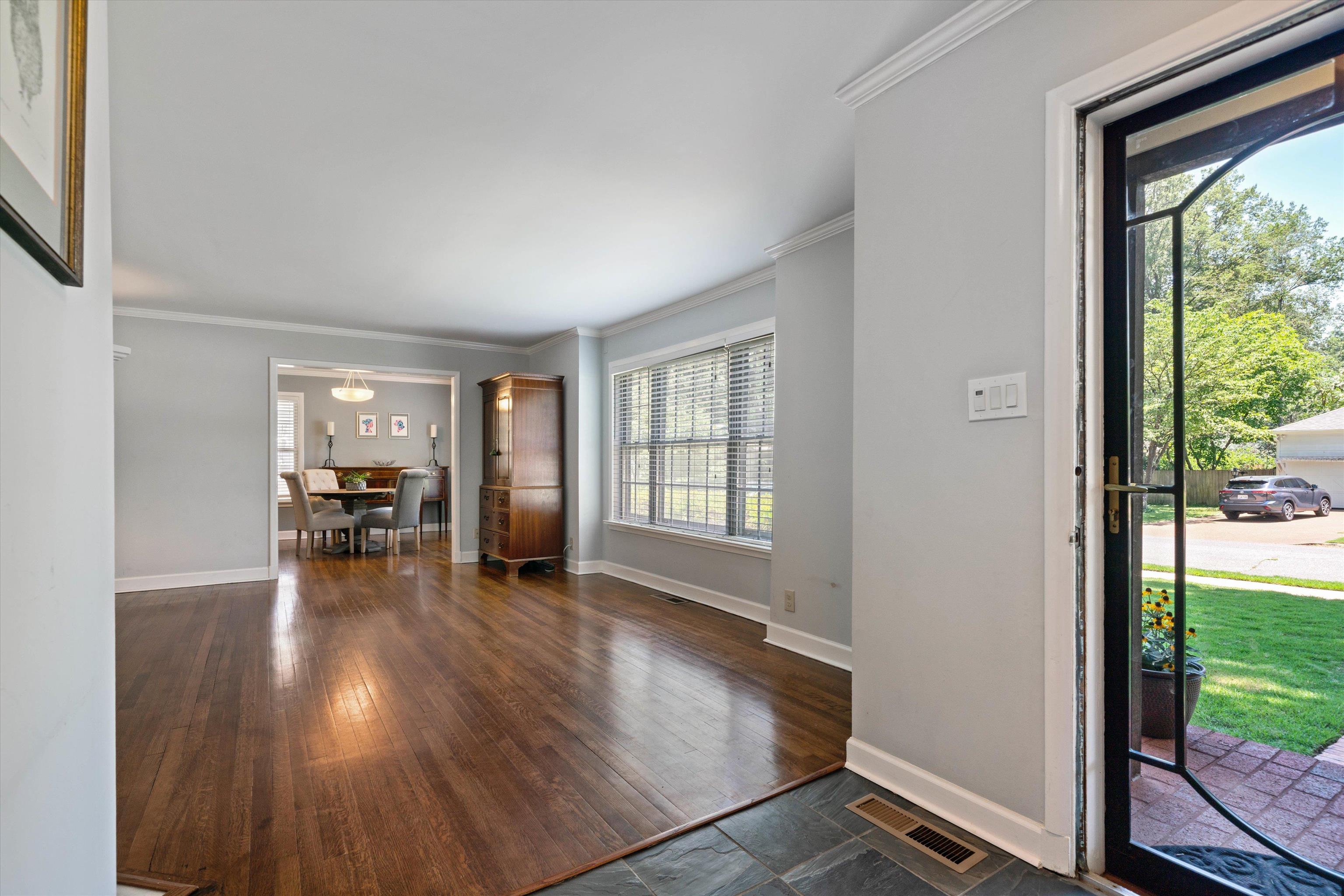 4208 Chickasaw Road Memphis, TN 38117 - Photo 4 of 25 a view of empty room with wooden floor and balcony