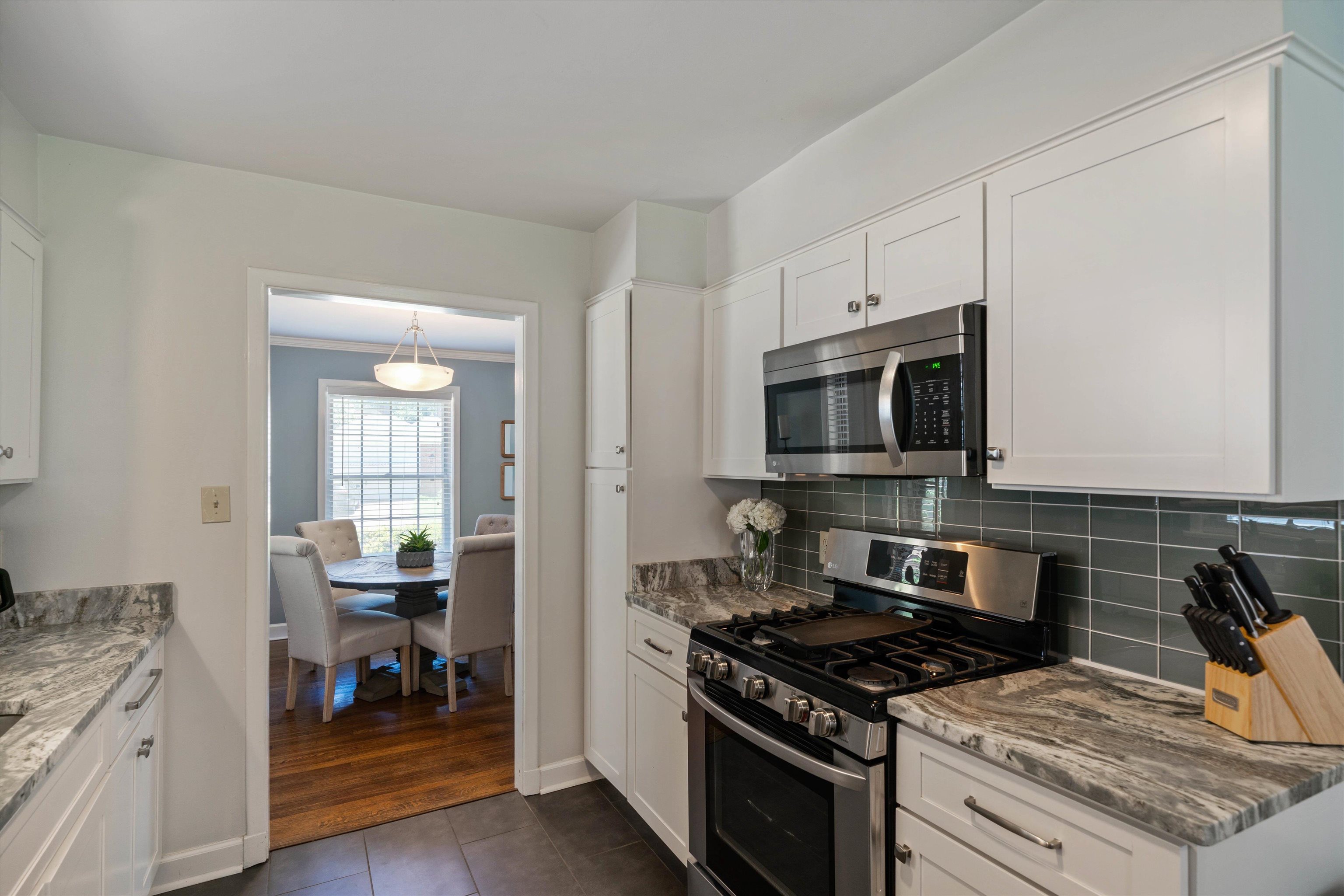 4208 Chickasaw Road Memphis, TN 38117 - Photo 9 of 25 a kitchen with a stove and a microwave
