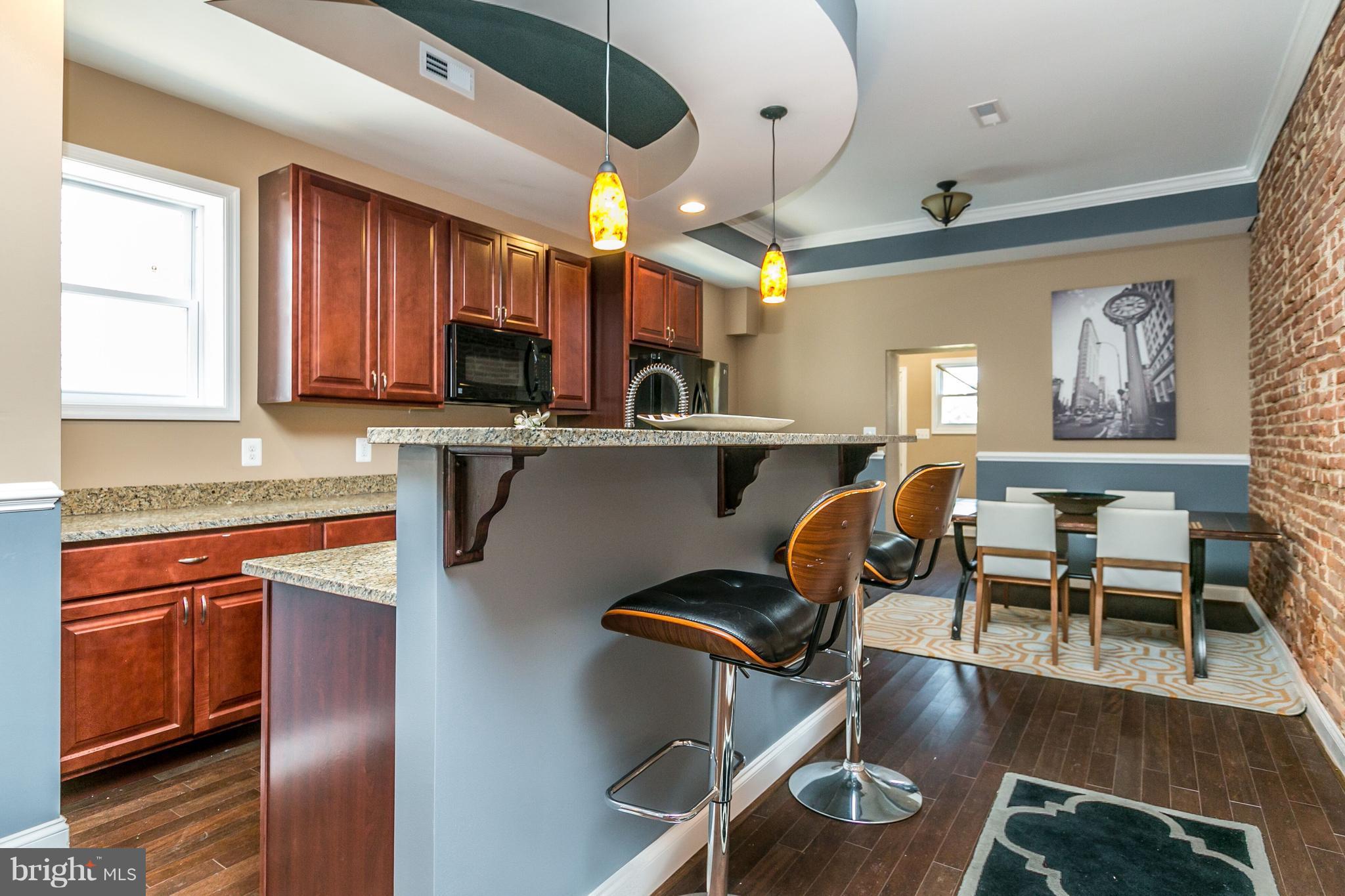 3619 Reisterstown Road Baltimore, MD 21215 - Photo 9 of 28 Kitchen+Breakfast Bar+Dining Room Combo