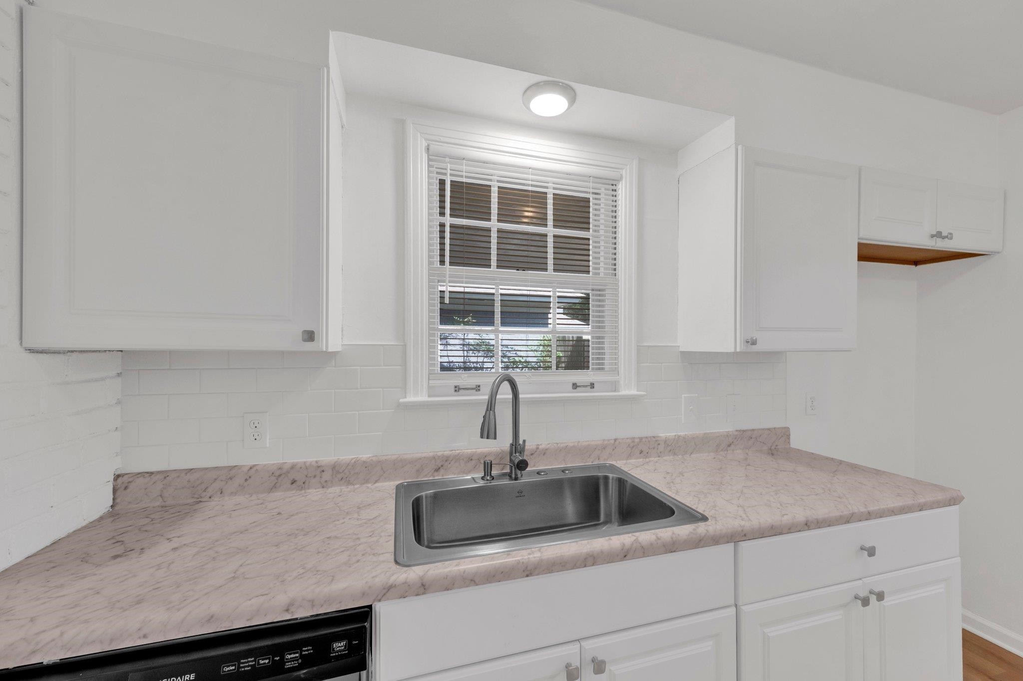 4936 Kaye Road Memphis, TN 38117 - Photo 15 of 32 a kitchen with a sink and cabinets
