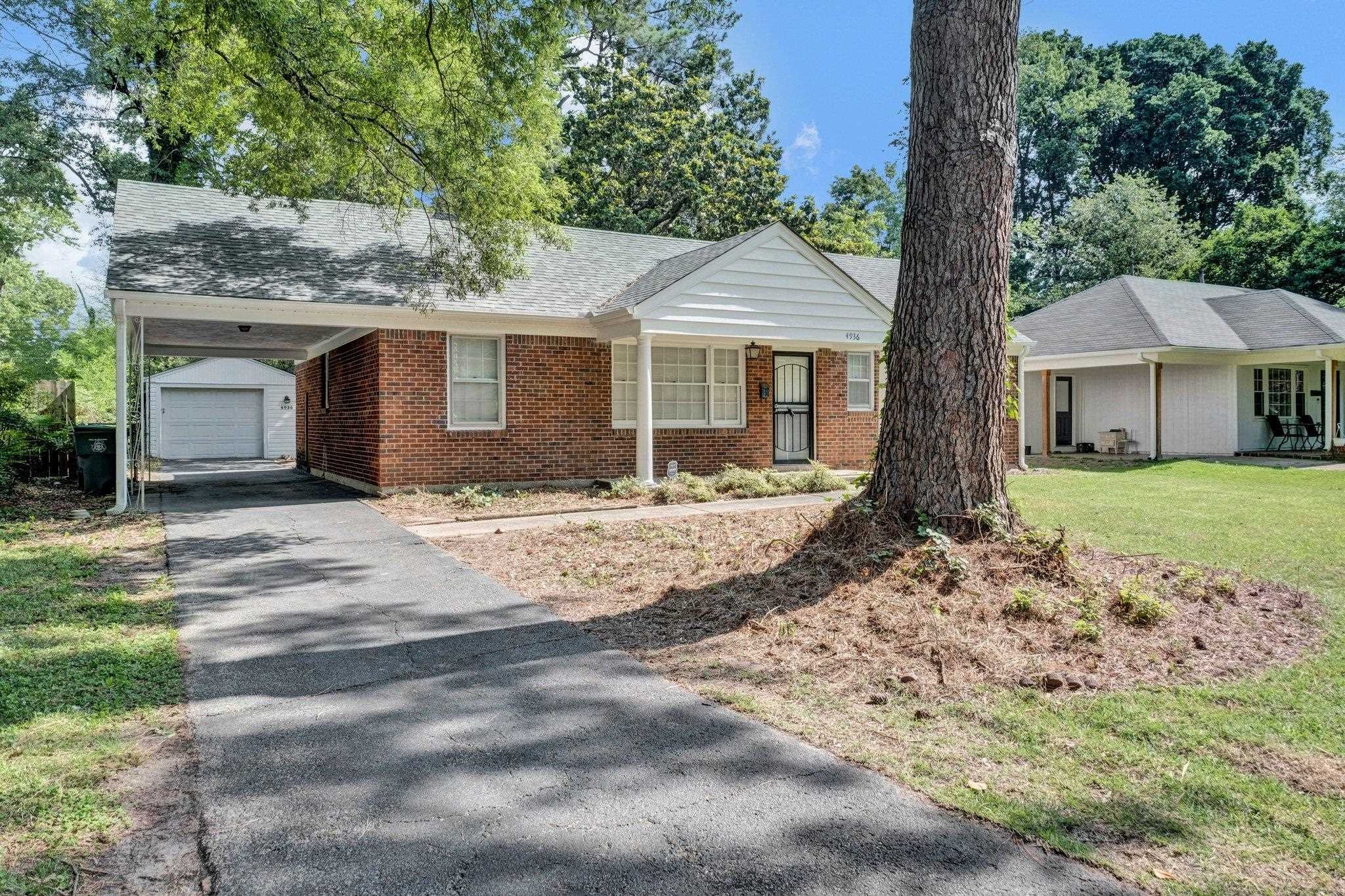 4936 Kaye Road Memphis, TN 38117 - Photo 3 of 32 a front view of a house with a yard