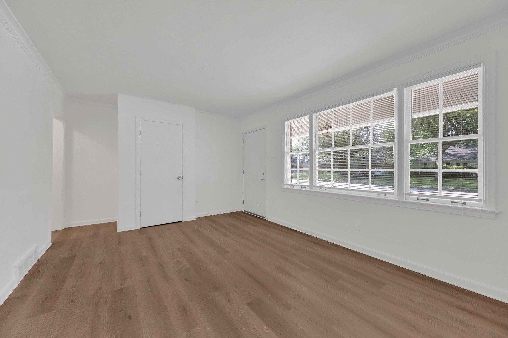 4936 Kaye Road Memphis, TN 38117 - Photo 8 of 32 a view of empty room with wooden floor and fan