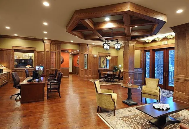 a living room with lots of furniture and a chandelier