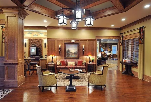 a living room with lots of furniture and wooden floor