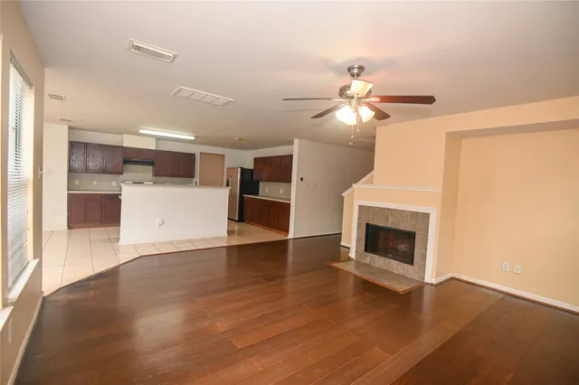 a view of a kitchen with a sink and a fireplace