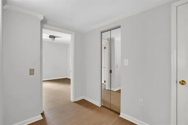 a bathroom with a bathtub shower sink mirror and toilet