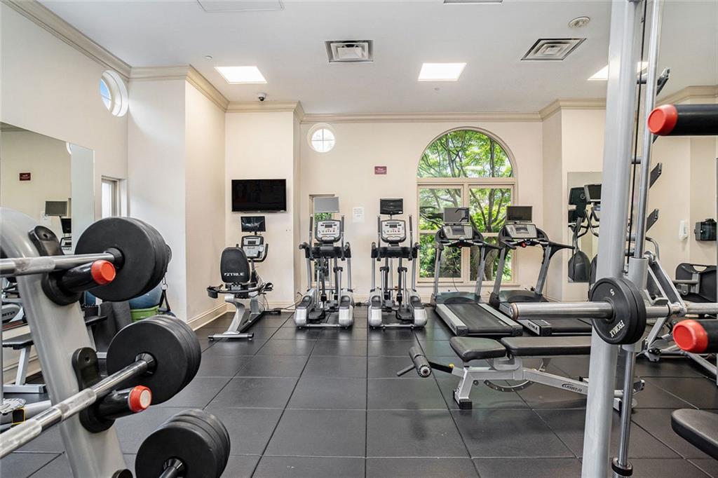199 14th Street Northeast, Unit 2308 Atlanta, GA 30309 - Photo 30 of 35 a view of a room with gym equipment